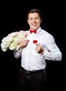 The elegant man with a ring and flowers Royalty Free Stock Photo