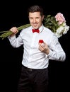 The elegant man with a ring and flowers Royalty Free Stock Photo