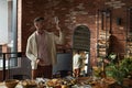 Elegant Man Serving Table for Dinner Party Royalty Free Stock Photo