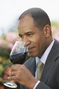 Elegant Man Smelling Red Wine Royalty Free Stock Photo