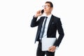 Elegant man, in a suit and glasses, talking on the phone and holding a laptop in his hand, on a white background Royalty Free Stock Photo