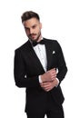 Elegant man in tuxedo fixing his sleeve Royalty Free Stock Photo