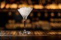 Elegant martini glass filled with ice on the bar