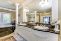 Elegant master bathroom with white columns