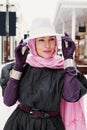 Elegant mature lady wearing fashionable clothing, felt hat, head scarf, long leather gloves, bracelets, coat dress. Portrait of Royalty Free Stock Photo