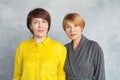 Elegant mature women portrait. Two ladies with short haircut