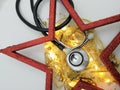 Elegant medical xmas card with stethoscope on red star