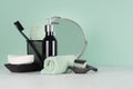 Elegant men dressing table in trend green mint menthe color - black razor, toothbrush, mirror, soap, towel, dispenser. Royalty Free Stock Photo