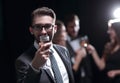 Elegant man raising his glass with the toast