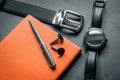 Elegant men`s business accessories. Black watches, belt, notepad, pen, cufflinks.Ã¢â¬Â¨ Royalty Free Stock Photo