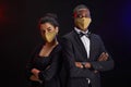 Elegant Mixed-Race Couple Wearing Masks at Party