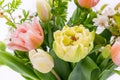 Elegant mixed tulips spring bouquet close up on white background. Spring tulips. Tulips bouquet.