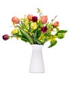 Elegant mixed tulips spring bouquet in white vase on white background. Spring tulips. Tulips bouquet cut out.