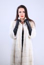 Elegant model in white fur coat of mink Royalty Free Stock Photo