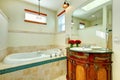 Elegant modern bathroom with an antique wooden storage cabinet Royalty Free Stock Photo