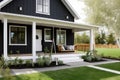 elegant and modern farmhouse exterior with black siding, white trim, and a porch swing