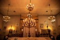 Elegant, modern interior of a religious building featuring two stunning chandeliers