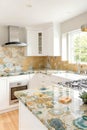 Elegant Modern Kitchen with Unique Stone Countertop and Bright Light Royalty Free Stock Photo