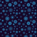 Elegant neon blue snowflakes of various styles isolated on dark background