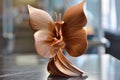 Elegant Origami Paper Sculpture of a Flower Displayed on Modern Interior Setup with Blurry Background
