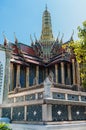 Elegant, Ornate roof and spire of building against a blue sky at Grand Palace, Thailand Royalty Free Stock Photo