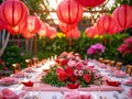 Elegant Outdoor Dinner Party Table Setting with Pink Lanterns and Floral Centerpieces at Twilight Royalty Free Stock Photo