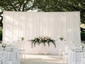 Elegant Outdoor Wedding Setup with White Decorations Royalty Free Stock Photo