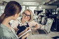 Elegant owner of restaurant having job interview with waitress Royalty Free Stock Photo