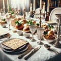 Elegant passover seder table with matzah and silver wine cups