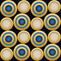 Elegant  Pattern, Striking Gold Rings with Blue, Beige and Dark Blue Beckground Royalty Free Stock Photo