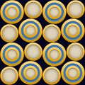 Elegant  Pattern, Striking Gold Rings with Blue, Beige and Dark Blue Beckground Royalty Free Stock Photo