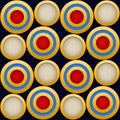 Elegant  Pattern, Striking Gold Rings with Red,Blue, Beige and Dark Blue Beckground Royalty Free Stock Photo