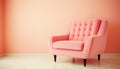 Elegant peach pink armchair in a minimalist room with a soft hued orange wall and light wooden flooring
