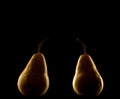 Elegant pear isolated on black background with backlighting Royalty Free Stock Photo