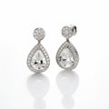 Elegant Pear Shaped White Gold Earrings With Diamond Stones Royalty Free Stock Photo