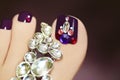 Elegant pedicure with rhinestones. Royalty Free Stock Photo