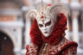 Elegant Person in Vibrant Carnival Costume and Mask at Venice Festival