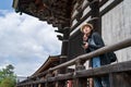 An elegant photographer relying on the handrail Royalty Free Stock Photo