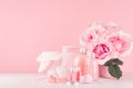 Elegant pink skin and body care products - cream, rose oil, liquid soap, salt, cotton towel and box - cosmetic accessories. Royalty Free Stock Photo