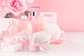 Elegant pink skin and body care products - cream, rose oil, liquid soap, salt, cotton towel and box - cosmetic accessories. Royalty Free Stock Photo