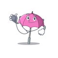 An elegant pink umbrella in a Doctor Cartoon character with tools Royalty Free Stock Photo