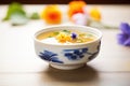 elegant porcelain bowl of miso soup, edible flowers garnish