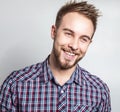 Elegant & positive young handsome man. Studio fashion portrait.