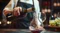 Elegant Pour - A sommelier pouring red wine into decanter Royalty Free Stock Photo