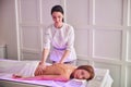 Elegant pretty woman with perfect body relaxing at the spa complex procedure in massage cabinet Royalty Free Stock Photo