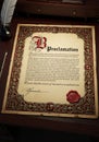 Elegant proclamation document with ornate calligraphy. Decorative red and gold Royalty Free Stock Photo