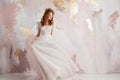 Elegant red-haired girl bride. Young beautiful woman in wedding dress Royalty Free Stock Photo