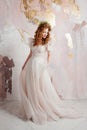 Elegant red-haired girl bride. Young beautiful woman in wedding dress Royalty Free Stock Photo