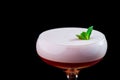 Elegant red ladies` cocktail with pink foam in a beautiful glass on a wooden carved round board Royalty Free Stock Photo