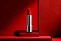 Elegant red lipstick displayed on a modern geometric backdrop with bold red tones Royalty Free Stock Photo